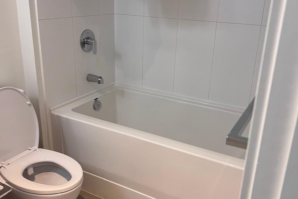 Clean bathtub and toilet ready for guests after a short term rental turnover in Vancouver BC