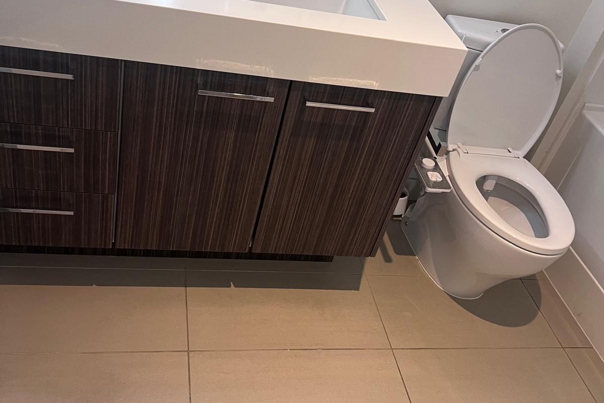 Clean bathroom vanity and tiled floor after a condo cleaning in North Vancouver BC