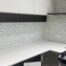 Clean kitchen with white counters and subway tile after a house cleaning in Vancouver BC