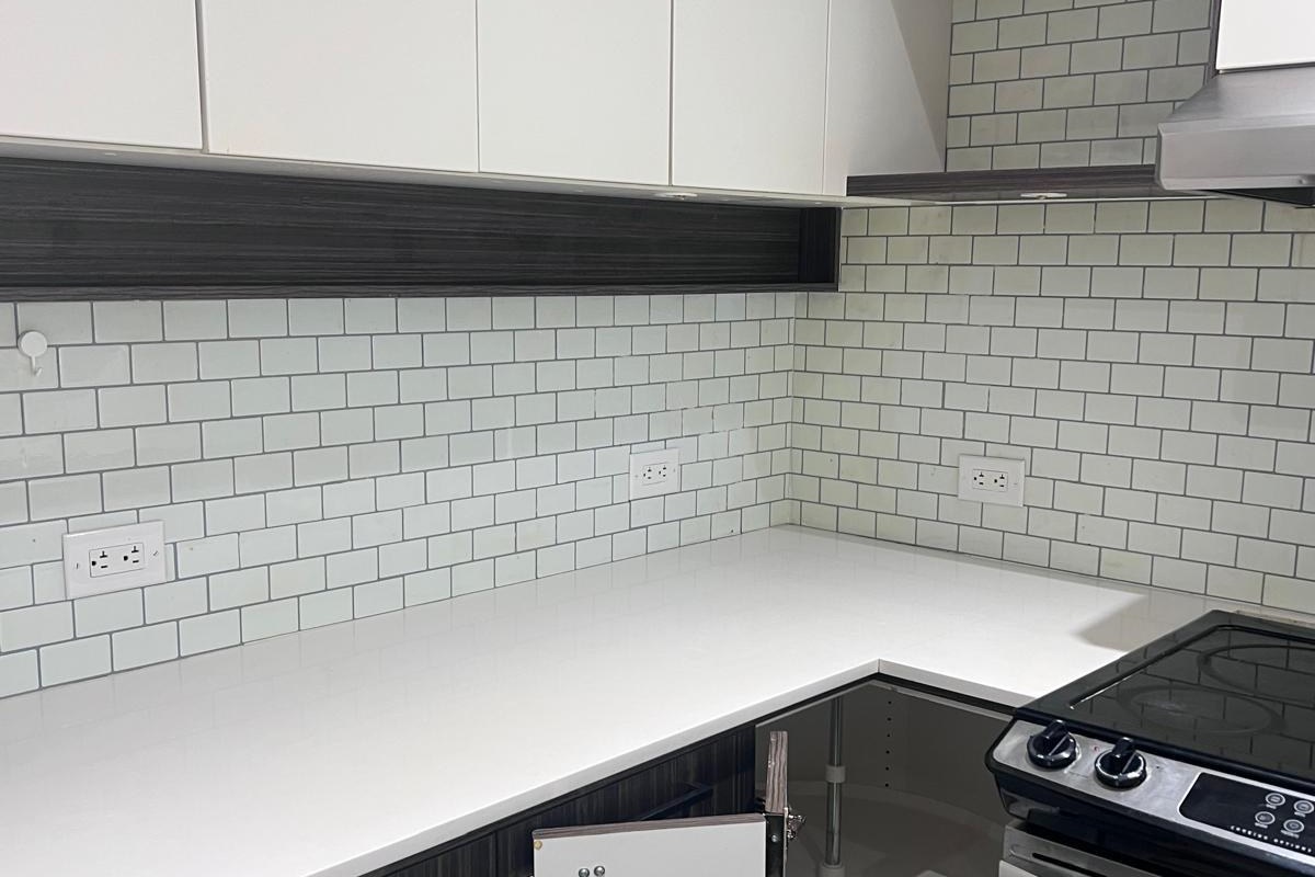 Clean kitchen with white counters and subway tile after a house cleaning in Vancouver BC