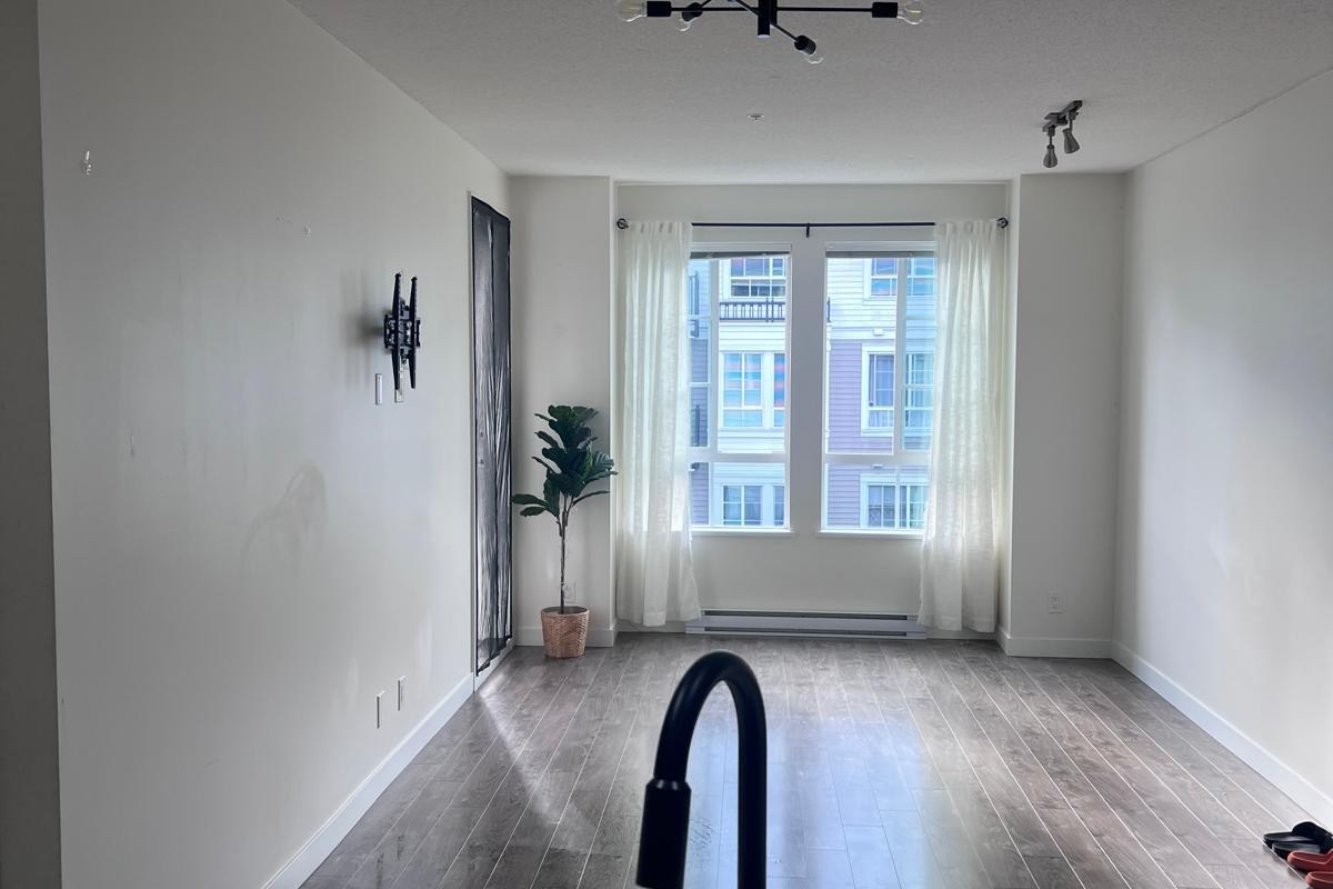 Clean kitchen sink and open living area after a flat rate house cleaning in Vancouver BC
